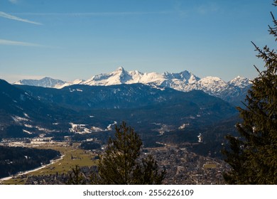 Snow-covered peaks rise above the charming town of Garmisch-Partenkirchen. The serene winter atmosphere captures the beauty of Bavaria, inviting exploration and adventure in the snow. - Powered by Shutterstock