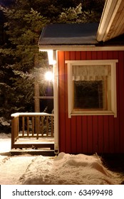 Snow-covered Porch Of The House And Night Lantern