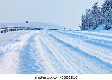 Snow-covered road on a winter day