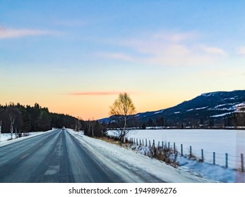 Snow-covered road through the center of Hemsedal in Viken, Norway in a winter landscape.