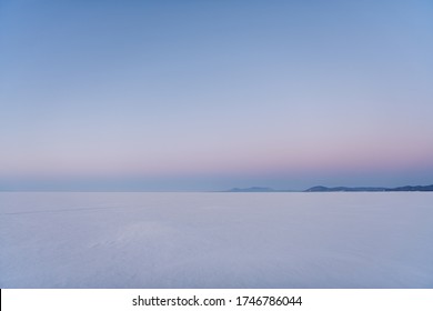 Snow-covered surface of Baikal Lake in the morning. Siberia, Russia - Shutterstock ID 1746786044