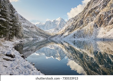 Snow-covered winter mountain lake, Russia, Siberia, Altai mountains, Chuya ridge. - Powered by Shutterstock