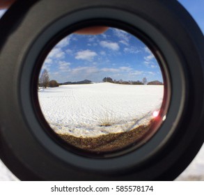 Snowed Meadow Seen Through A Camera Lens