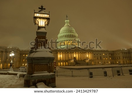 Snowfall in DC. Winter in American Capitol Washington D.C. Capitol building at night evening winter. U.S. Capitol in snow historical photos. Winter Capitol Hill in Washington D.C.