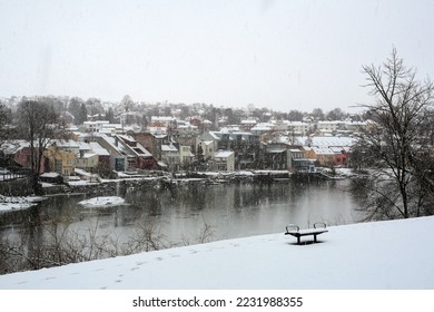 Snowfall in Norwegian city Trondheim, view of the river Nidelva and district Bakklandet along the river  - Shutterstock ID 2231988355
