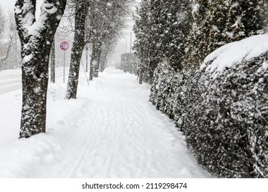 Snowfall. Snowy And Dusty City Streets. Slippery Sidewalk.