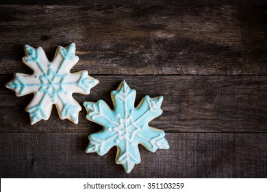 Snowflake Cookies On Wooden Background