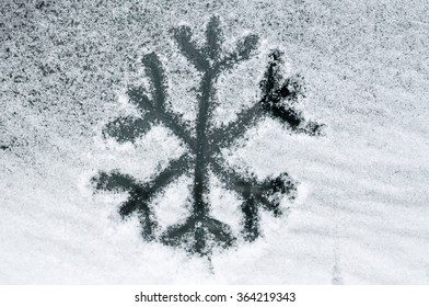 Snowflake Drawn In Snow On Car Window