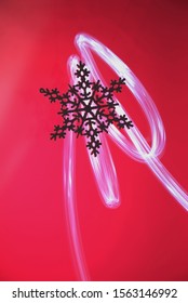 snowflake on a colored background with drawing light