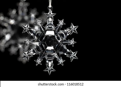 Snowflake ornaments on black background