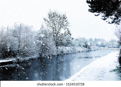 Snowing In England, UK, Beautiful Winter Walk Along The Path Near The Canal