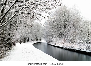 Snowing In England, UK, Beautiful Winter Walk Along The Path Near The Canal