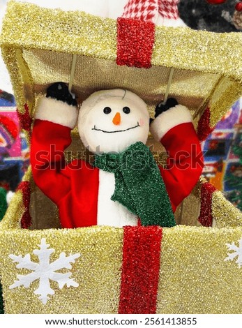 
Snowman in a box, Christmas toy for the new year 2025. 
New Year's snowman made of cotton wool