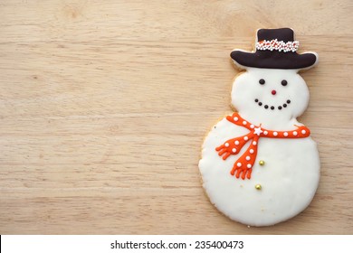 Snowman Cookie On Wood Background