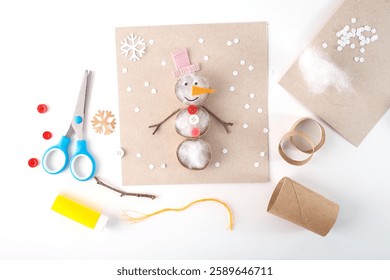 snowman craft tutorial using natural materials on beige cardboard. Flat lay collage showing DIY process. Winter holidays and Christmas decoration. Design for greeting card, invitation, postcard