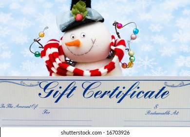 Snowman With Gift Certificate On Blue Snowflake Background, Merry Christmas