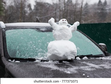 Snowman On The Car Hood