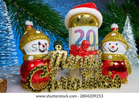 A snowman in a red hat and a pine cone against the background of fir tree branches and a Christmas lantern