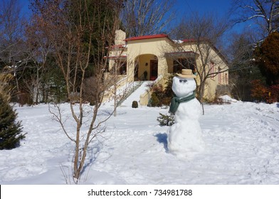 Snowman with Sunglasses and Hat in the Front Yard
