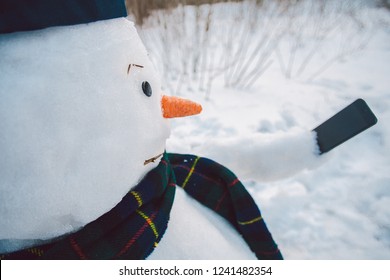 Snowman Using Smart Phone