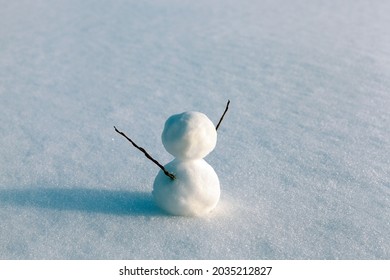 snowmen made of snow in winter, small snowmen stand on the snow in winter