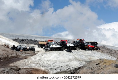 Snowmobile Group On A Mountain Slope