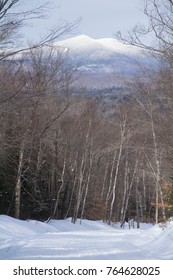 Snowmobile And Hiking Trail Covered In Snow In Winter On Bald Mountain In Rangeley, Maine, With A View Of Kennebago Mountain In The Distance.