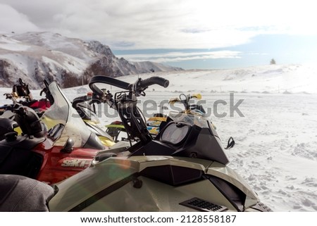 A snowmobile on a barren winter landscape