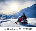 Snowmobile on a trail in the Italian alps