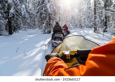 Snowmobiling in the Urals mountains on a frosty day.