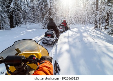 Snowmobiling in the Urals mountains on a frosty day.