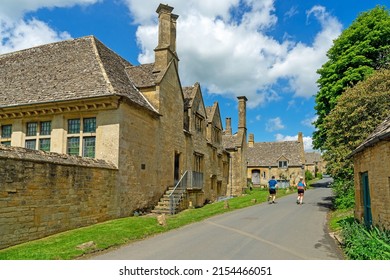 Snowshill, Gloucestershire, UK, May 7th, 2022, Joggers Exercising On The Main Highway Through The Village In Spring.