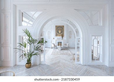 snow-white luxury apartment interior with Egyptian-style decor with light stylish furniture. huge panoramic windows and an archway. minimalism and simplicity with the elegance of modern housing design - Shutterstock ID 2187330459