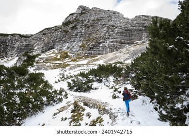 Snowy Autumn Landscape Adversity for Woman Solo Hiker on Alpine Mountain Trail Path - Powered by Shutterstock