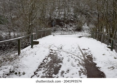 Snowy Bridge Across The Railroad