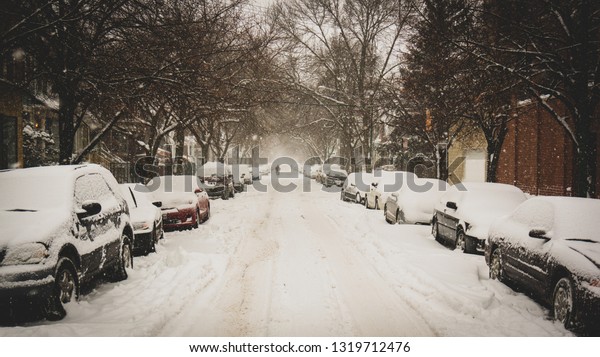 snowy chicago\
neighborhood street in\
winter