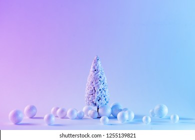 Snowy Christmas tree in vibrant bold gradient holographic colors. Concept art. Minimal New Year surrealism. - Powered by Shutterstock