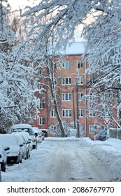 Snowy City Scene With Snow On The Streets And Trees