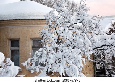 Snowy City Scene With Snow On The Streets And Trees