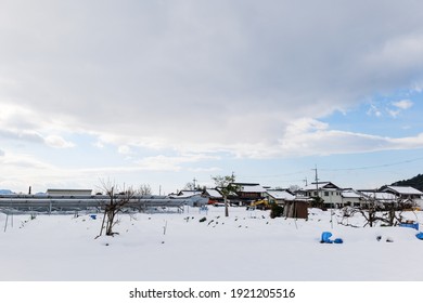 A Snowy City Scene In Winter In Japan