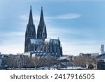 snowy city view with the cologne cathedral on a cold january day in 2024