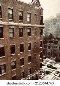 Snowy cityscape. Look at flurries dancing in front of a beautiful vintage Chicago building.