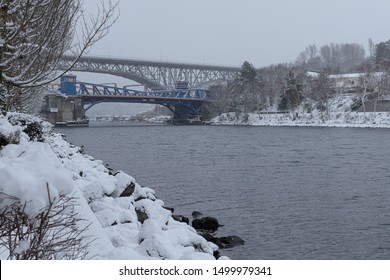 snowy day from Fremont Canal Park in front of Google building in Seattle washington, looking at Fremont Bridge