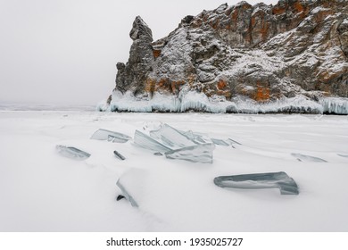 Snowy Day On The Lake In Siberia, Russia. Ice Sheets On Frozen Lake Baikal.