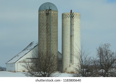 Snowy Farm Scene With Two Silos