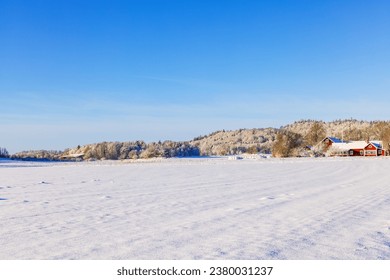 Snowy field with a house in the countryside - Powered by Shutterstock