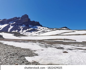 Snowy flat area in higg altitude in Swiss Alps near Forclaz pass on a sunny day