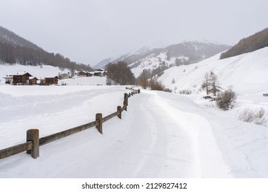 Snowy Footpath Leading To Mountains In Popular Italian Ski Resort Livigno In Alps. The Way Forward Concept