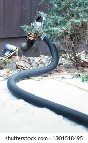 In The Snowy Garden You Can See A Hose. Heating Oil Is Supplied In The Hose. The Hose Carries The Oil Into The Tank In The House For Heating. For A Connection Outside The House Is Appropriate.