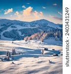 Snowy hills of Alpe di Siusi ski resort. Astonishing winter landscape of Dolomite Alps, Italy, Europe. Spectacular outdoor scene of Italian countryside. Beauty of nature concept background.